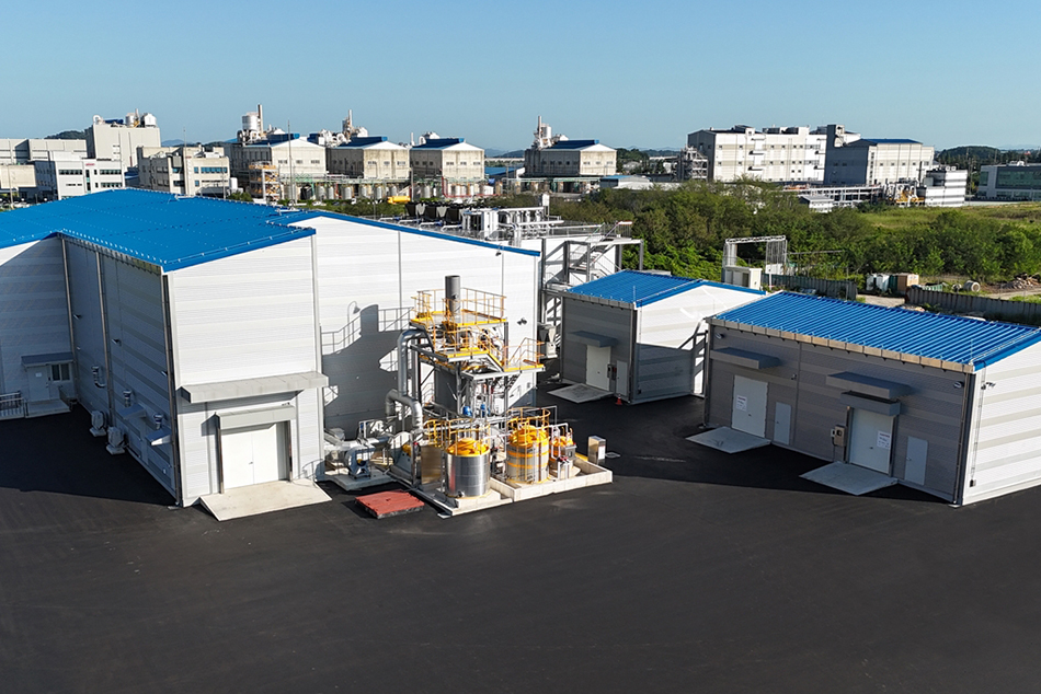 LOTTE ENergy Materials solid-state electrolyte manufacturing plant in Korea, white industrial building with blue sky