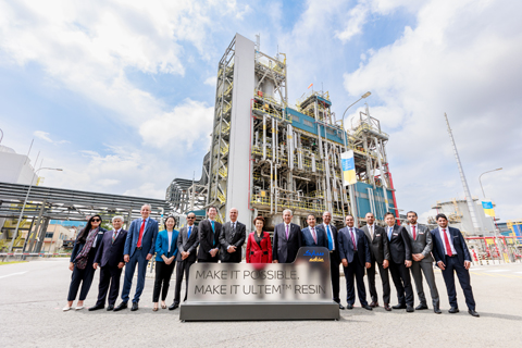 Leadership from SABIC and the Singapore government gathered fr the opening of the new resin plant. A group of people standing in front of a new chemical manufacturing plant.